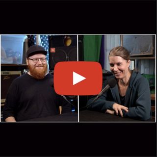 Man and woman smiling and talking with playbutton on top